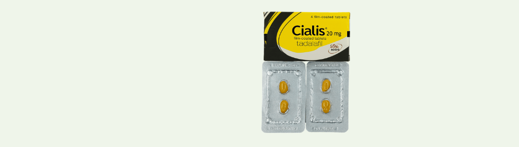 Cialis 20mg tadalafil box with two blister packs containing four yellow tablets on a light background